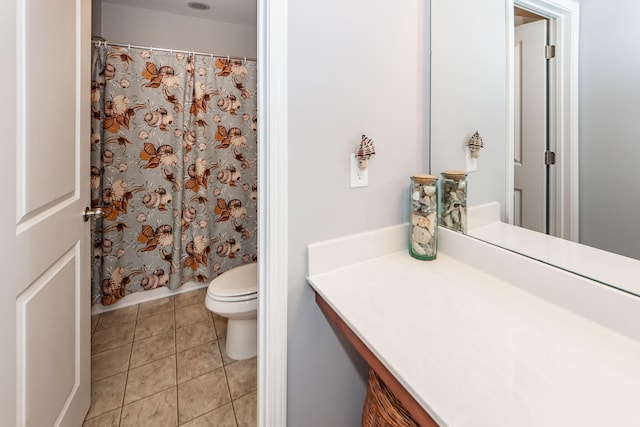 bathroom featuring vanity, a shower with curtain, toilet, and tile patterned floors