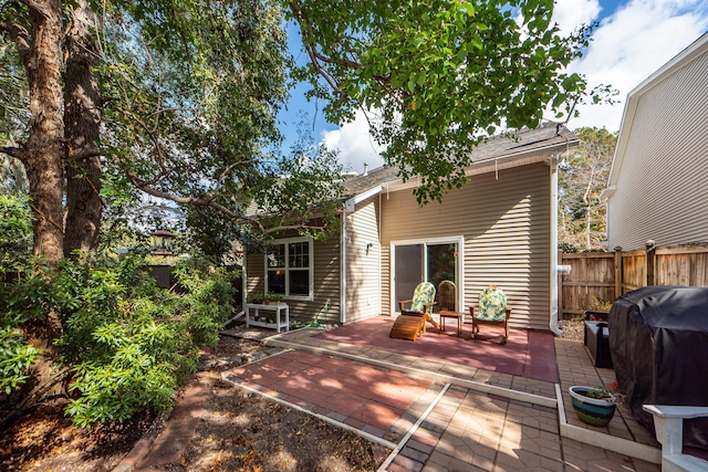 rear view of property featuring a patio area