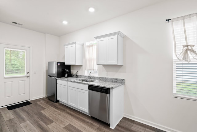 309 Sedona Dr, Summerville, SC 29486 - kitchen featuring appliances with stainless steel finishes, a sink, dark wood finished floors, white cabinetry, and light stone counters