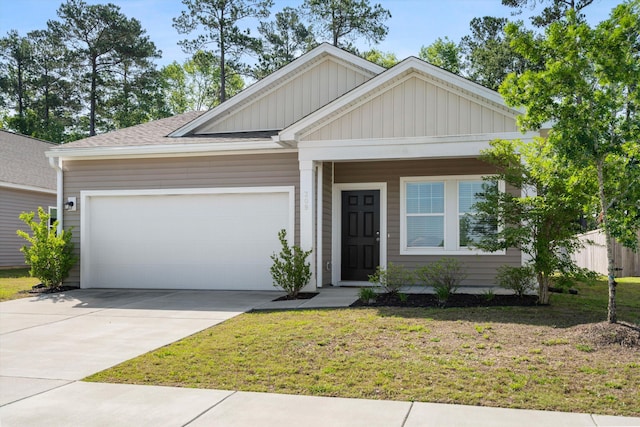 309 Sedona Dr, Summerville, SC 29486 - view of front of house featuring a garage, board and batten siding, concrete driveway, and a front yard
