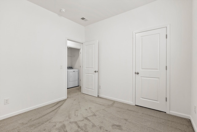 309 Sedona Dr, Summerville, SC 29486 - unfurnished bedroom featuring washer / dryer, light colored carpet, and baseboards