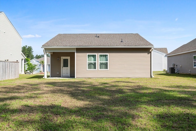 309 Sedona Dr, Summerville, SC 29486 - rear view of house featuring a yard, a shingled roof, and central air condition unit