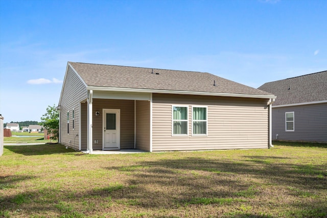 309 Sedona Dr, Summerville, SC 29486 - back of property with a yard, a patio area, and a shingled roof