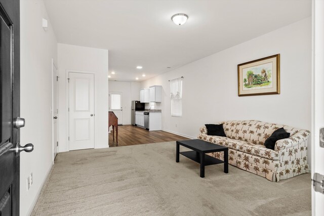 309 Sedona Dr, Summerville, SC 29486 - living area with dark colored carpet, recessed lighting, baseboards, and dark wood-style floors