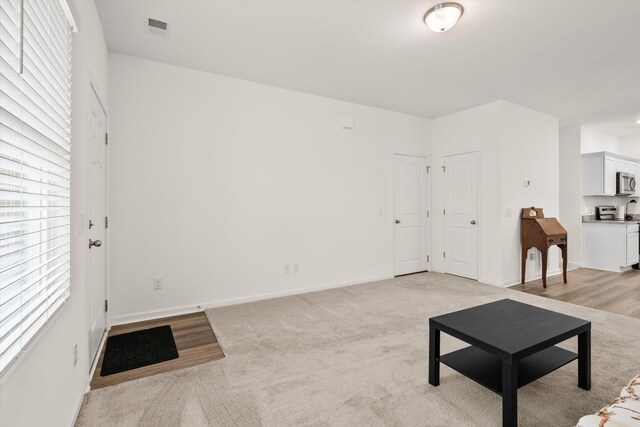 309 Sedona Dr, Summerville, SC 29486 - living area with baseboards and light colored carpet