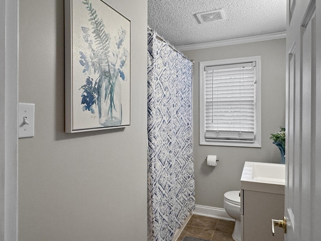 bathroom with visible vents, toilet, ornamental molding, tile patterned flooring, and a textured ceiling