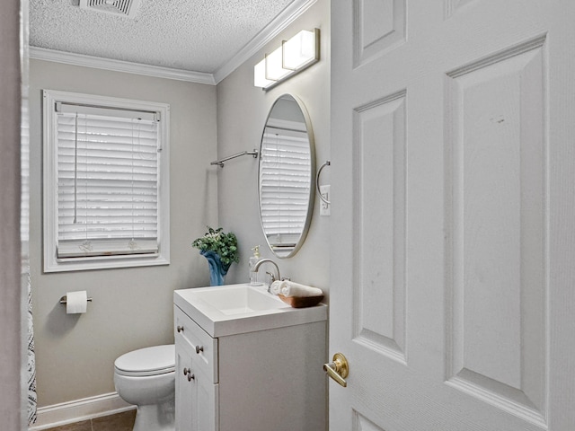 bathroom with crown molding, toilet, a textured ceiling, vanity, and baseboards