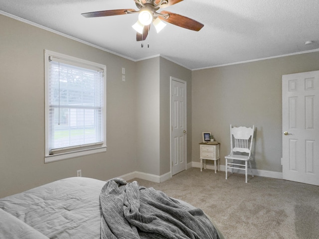 bedroom with a textured ceiling, ornamental molding, carpet, and baseboards