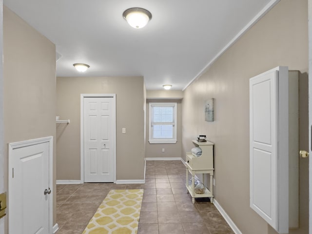 tiled foyer with baseboards