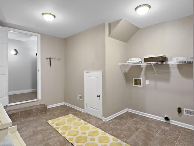 laundry room with hookup for a washing machine, baseboards, laundry area, and visible vents