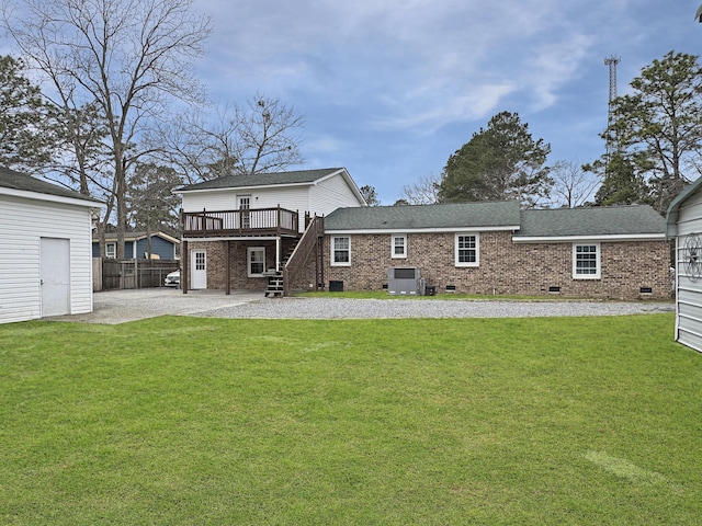 back of property featuring a patio, crawl space, gravel driveway, stairs, and brick siding