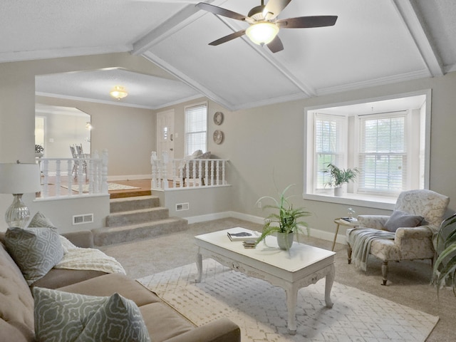 living area featuring carpet floors, lofted ceiling with beams, visible vents, and a wealth of natural light