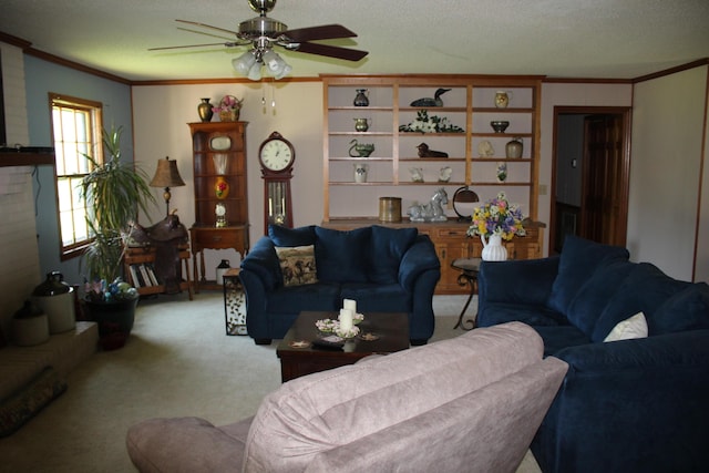 carpeted living room featuring ceiling fan, a textured ceiling, and ornamental molding