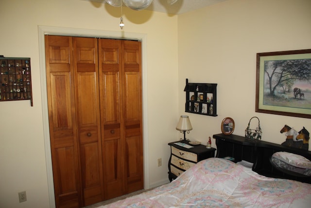 bedroom with a closet and ceiling fan