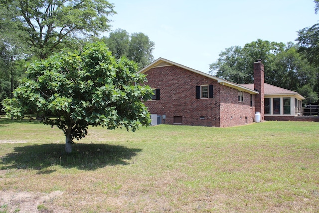 view of yard featuring central AC unit