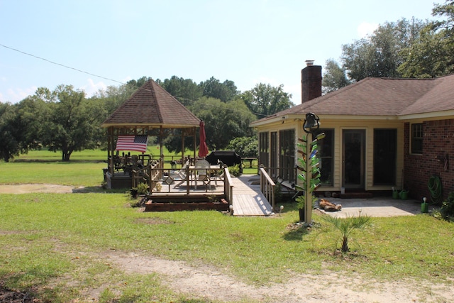 view of yard featuring a gazebo and a wooden deck