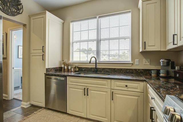 kitchen featuring plenty of natural light, dishwasher, stove, and sink