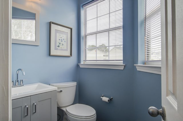 bathroom with toilet and vanity