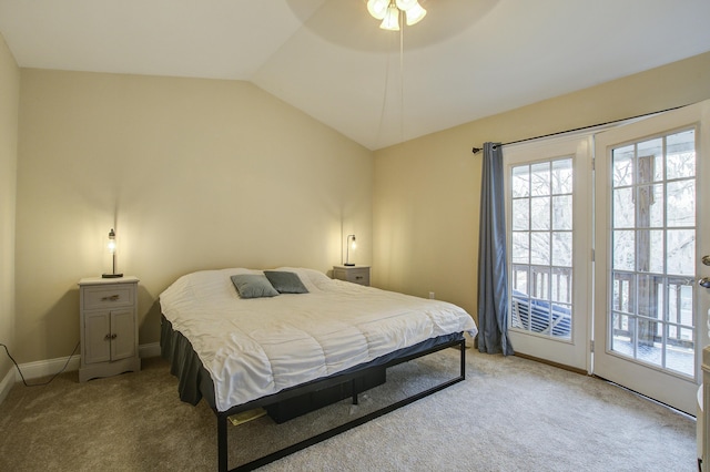 bedroom with ceiling fan, vaulted ceiling, light carpet, and access to exterior