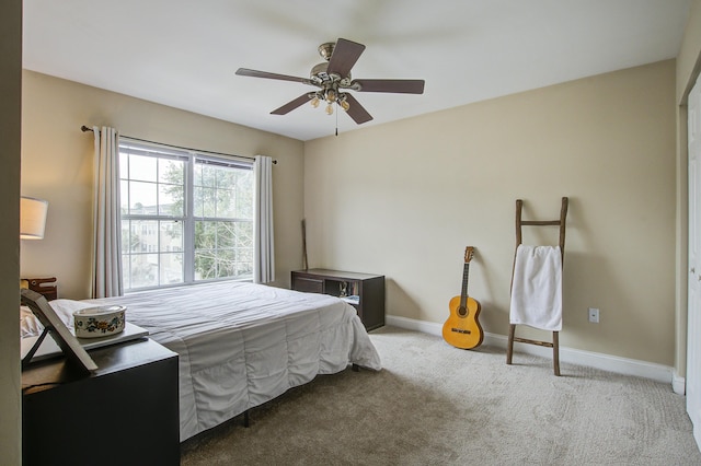 carpeted bedroom with ceiling fan