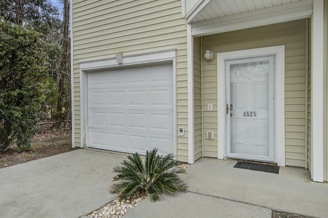 view of exterior entry featuring a garage