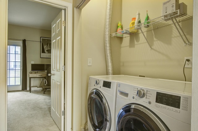 laundry room featuring independent washer and dryer and light colored carpet