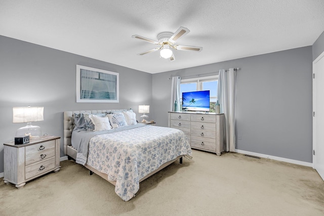 166 River Breeze Dr, Charleston, SC 29407 - bedroom with light colored carpet, baseboards, ceiling fan, and a textured ceiling