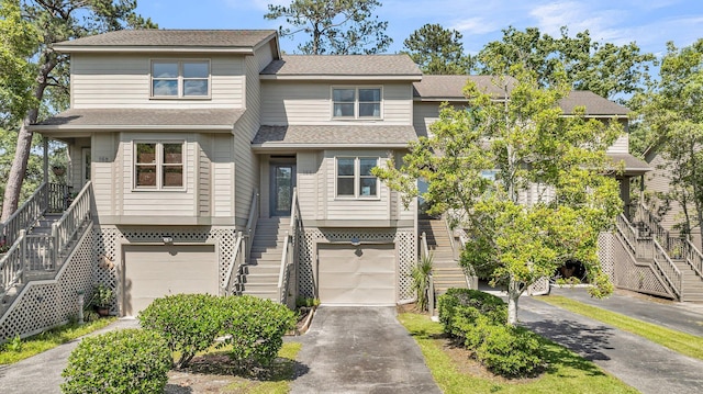 166 River Breeze Dr, Charleston, SC 29407 - view of front of home featuring stairway, a garage, driveway, and roof with shingles
