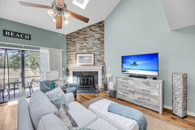 166 River Breeze Dr, Charleston, SC 29407 - living area featuring high vaulted ceiling, ceiling fan, wood finished floors, a fireplace, and baseboards