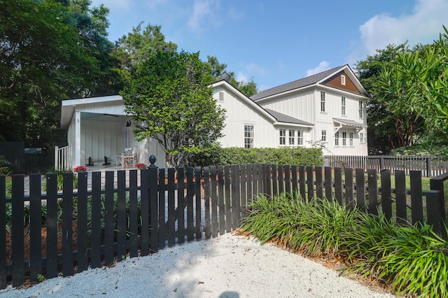1151 Camellia Dr, Mount Pleasant, SC 29464 - view of front of property featuring a fenced front yard and board and batten siding