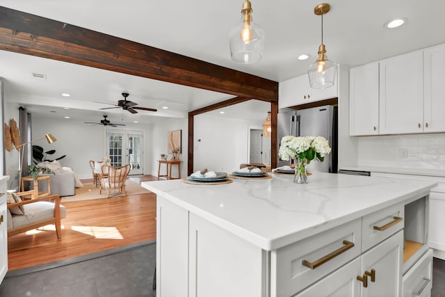 1151 Camellia Dr, Mount Pleasant, SC 29464 - kitchen with recessed lighting, high end fridge, white cabinetry, ceiling fan, and decorative light fixtures