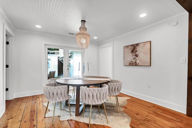 1151 Camellia Dr, Mount Pleasant, SC 29464 - dining room featuring baseboards, crown molding, hardwood / wood-style flooring, a chandelier, and recessed lighting