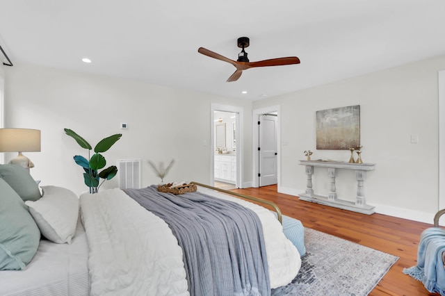 1151 Camellia Dr, Mount Pleasant, SC 29464 - bedroom with wood finished floors, baseboards, recessed lighting, a ceiling fan, and connected bathroom