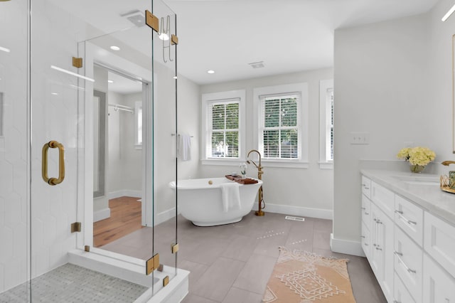 1151 Camellia Dr, Mount Pleasant, SC 29464 - full bath with vanity, a freestanding tub, a stall shower, baseboards, and tile patterned flooring