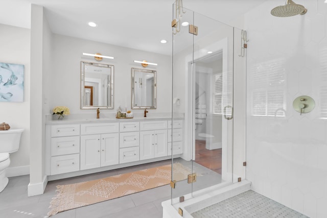 1151 Camellia Dr, Mount Pleasant, SC 29464 - bathroom with toilet, a shower stall, double vanity, recessed lighting, and baseboards