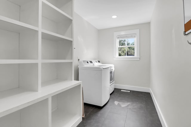 1151 Camellia Dr, Mount Pleasant, SC 29464 - washroom featuring washing machine and dryer, baseboards, and dark tile patterned floors