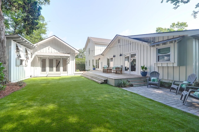 1151 Camellia Dr, Mount Pleasant, SC 29464 - back of house with board and batten siding, french doors, and a deck
