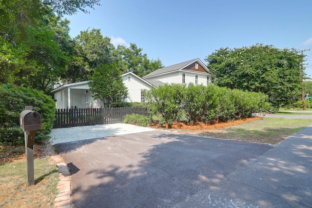 1151 Camellia Dr, Mount Pleasant, SC 29464 - view of side of home featuring board and batten siding and a fenced front yard