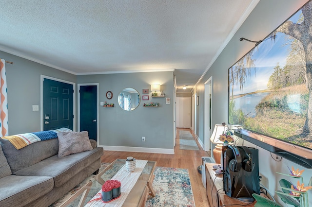 living room featuring ornamental molding, a textured ceiling, and light hardwood / wood-style flooring