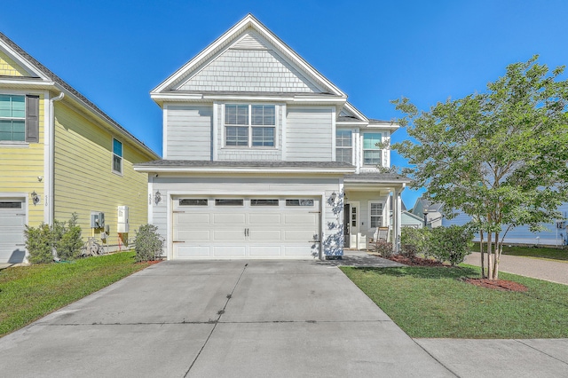 view of front facade with an attached garage, driveway, and a front lawn