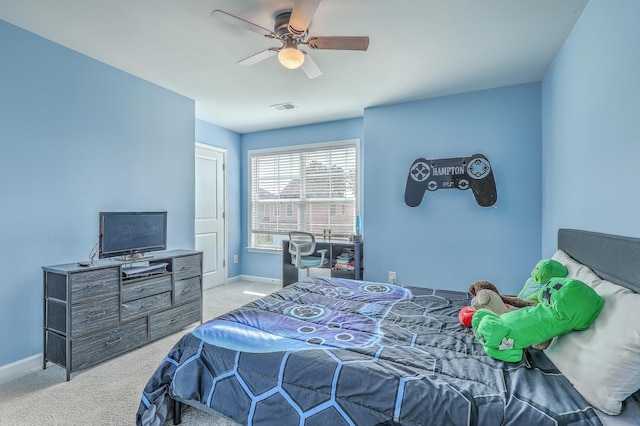 carpeted bedroom with a ceiling fan, baseboards, and visible vents