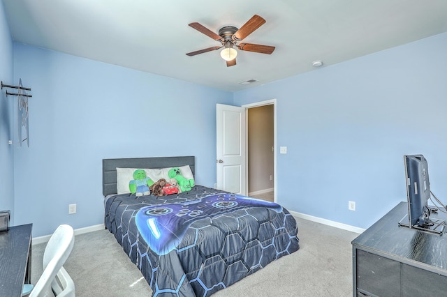 bedroom with carpet floors, a ceiling fan, baseboards, and visible vents