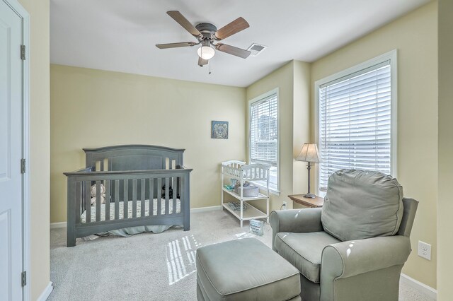 bedroom with baseboards, visible vents, and carpet