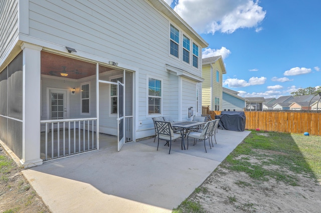 view of patio / terrace with fence and a grill