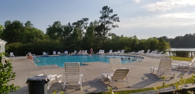 community pool with a patio area