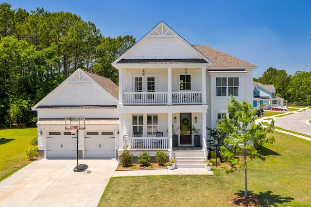 2828 Wagner Way, Mount Pleasant, SC 29466 - neoclassical home with covered porch, concrete driveway, a front lawn, an attached garage, and a balcony