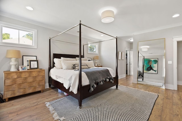 2828 Wagner Way, Mount Pleasant, SC 29466 - bedroom with crown molding, light wood-style flooring, baseboards, and recessed lighting