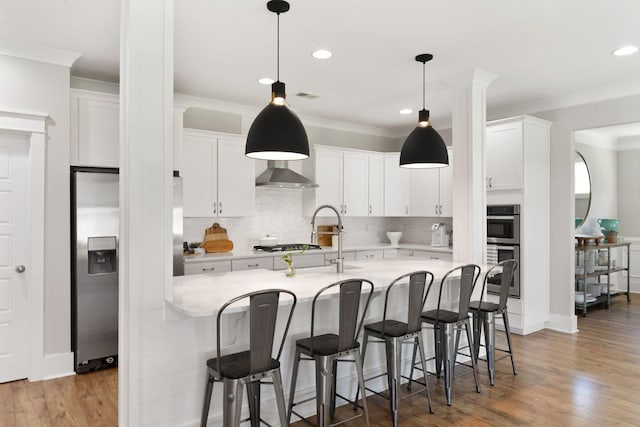 2828 Wagner Way, Mount Pleasant, SC 29466 - kitchen featuring fridge with ice dispenser, a sink, crown molding, light countertops, and decorative backsplash