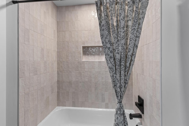 bathroom with shower / washtub combination
