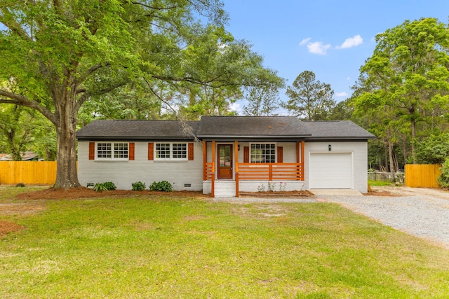 ranch-style house with brick siding, an attached garage, driveway, crawl space, and covered porch